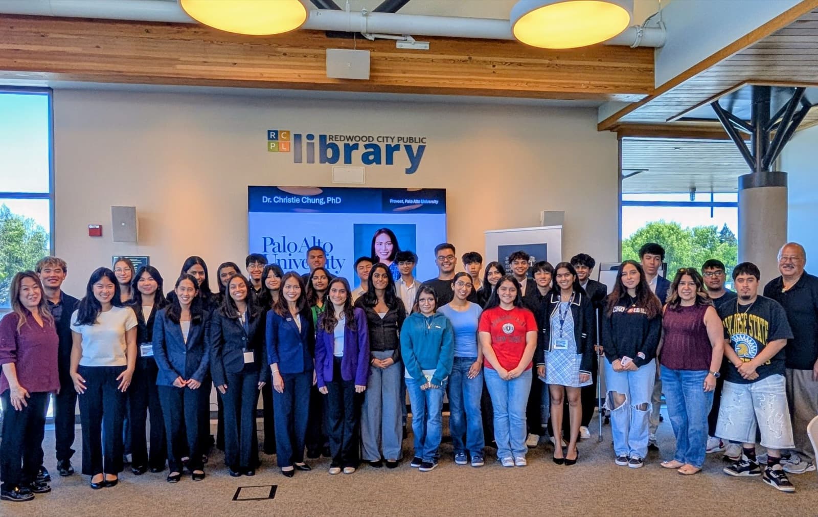 A large group of high school and college students gathered at a Redwood City Public Library event.
